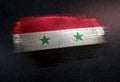 Syria Flag Made of Metallic Brush Paint on Grunge Dark Wall