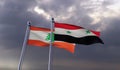 Syria and Lebanon, two flags waving against dark cloudy sky