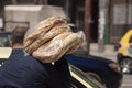 Syrian Baker carrying fresh made flat breads