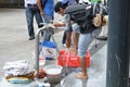 Syrian migrant washes the feet in a makeshift source prepared by firefighters near the international railway station