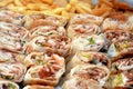Syrian recipe cuisine background, a box full of pieces of chicken shawerma or shawarma tortilla wrap with onion, tomato, lettuce