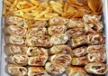 Syrian recipe cuisine background, a box full of pieces of chicken shawerma or shawarma tortilla wrap with onion, tomato, lettuce