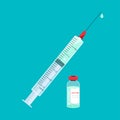 A syringe and a ampoule with the vaccine.