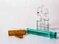 A syringe and ampules on white background Royalty Free Stock Photo