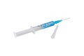 Syringe with blue liquid and a needle isolated