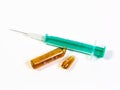 A syringe and a broken ampule on white background Royalty Free Stock Photo