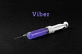 A syringe on a dark background and the word viber. The concept of Internet addiction, messenger mania