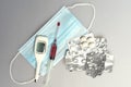 syringe , disposable mask, tablets in a blister, empty blisters for tablets, electronic thermometer