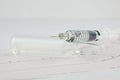 Syringe on EKG heart sheet Royalty Free Stock Photo