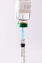 Syringe filling from vial of clear liquid such as insulin, on white background Royalty Free Stock Photo