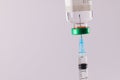 Syringe filling from vial of clear liquid such as insulin, on white background with copy space Royalty Free Stock Photo