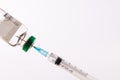 Syringe filling from vial of clear liquid such as insulin, on white background with copy space Royalty Free Stock Photo