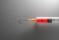Syringe with a fishing hook for a needle. Addiction, substance abuse, healthcare scam concept. Digital 3D rendering.