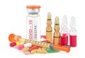 Syringe with glass vials and medicinal tablets and pills isolated on a white background. Covid-19 vaccine.