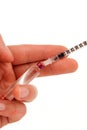 Syringe in hand Royalty Free Stock Photo