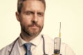 syringe in hands of doctor. syringe for anaesthesia. selective focus of syringe