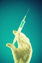 Syringe hold by a medic hand Royalty Free Stock Photo
