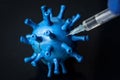 Syringe injection in model of COVID-19 corona virus close-up Royalty Free Stock Photo