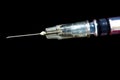 Syringe, injection needle on black background Royalty Free Stock Photo