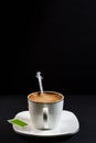 Syringe inside cup of coffee with milk on porcelain plate Royalty Free Stock Photo