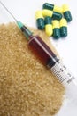 Syringe, needle, drug capsules, crystals