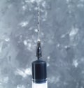 A syringe with a needle filled with crude oil Royalty Free Stock Photo