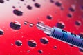 Syringe needle with fluid drops Royalty Free Stock Photo