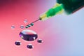 Syringe needle with fluid drops Royalty Free Stock Photo