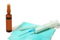 Syringe with the needle on hygienic napkin and ampule Royalty Free Stock Photo