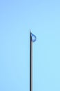 Syringe needle with liquid drop on the tip macro close up isolated on blue Royalty Free Stock Photo