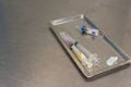 Syringe with needle on a steel tray Royalty Free Stock Photo