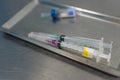 Syringe with needle on a steel tray Royalty Free Stock Photo