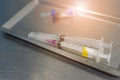 Syringe with needle on a steel tray Royalty Free Stock Photo