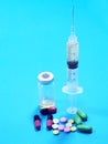 Syringe and pills