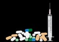 Syringe and pills isolated on black
