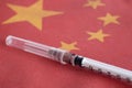 Syringe pointing on China national flag. Corona Virus outbreak concept. China Crisis Royalty Free Stock Photo