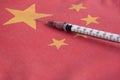 Syringe pointing on China national flag. Corona Virus outbreak concept. China Crisis Royalty Free Stock Photo