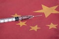 Syringe pointing on China national flag. Corona Virus outbreak concept. China Crisis Royalty Free Stock Photo