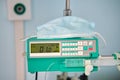 A syringe pump, a dropper for anesthesia and drug administration during operations and medical procedures in a hospital Royalty Free Stock Photo