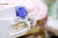 Syringe pump machine with monitor display pumping milk to sick newborn baby