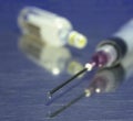 Syringe, sharp needle and ampule Royalty Free Stock Photo
