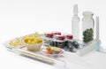 Syringe, thermometer, tablets and capsules in blisters isolated