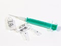 A syringe and two broken ampules on white background Royalty Free Stock Photo