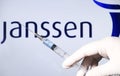 Syringe with vaccine and janssen logo