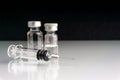 Syringe and vials closeup with selective focus and crop fragment