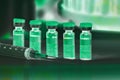 Syringe and vials of injectable drugs - green