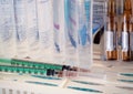 Syringes, ampoules with medicine, saline on a shelf. Medical background for business, pharmacies, hospitals