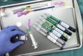 Syringes of insulin medication next to medicine vials prepared in hospital, conceptual image