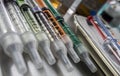 Syringes of insulin medication next to medicine vials prepared in hospital