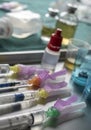 Syringes loaded with medication next to medicine vials prepared in hospital